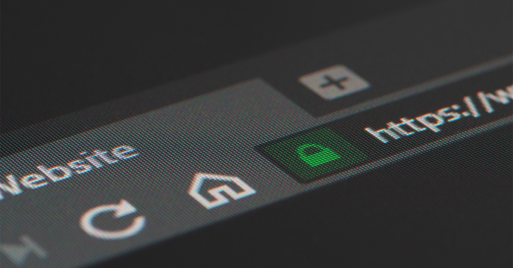 Web browser closeup on LCD screen with shallow focus on https padlock.